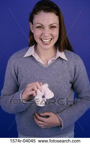 Portrait of a pregnant woman holding baby booties View Large Photo Image Stock Photography - Portrait of a pregnant woman holding baby booties. Fotosearch