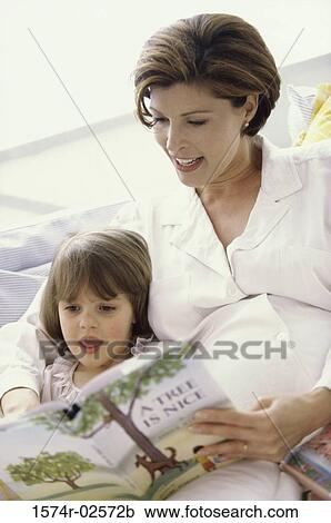 Pregnant woman teaching her daughter View Large Photo Image Stock Image - Pregnant woman teaching her daughter. Fotosearch