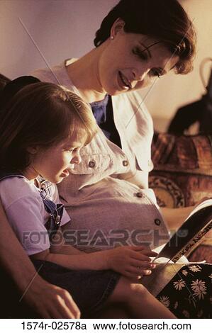 Pregnant woman teaching her daughter View Large Photo Image Stock Image - Pregnant woman teaching her daughter. Fotosearch