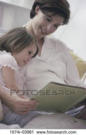 Pregnant woman teaching her daughter View Large Photo Image Stock Image - Pregnant woman teaching her daughter. Fotosearch