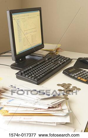 Stock Photo - Desktop pc with envelopes and coins on a table. Fotosearch