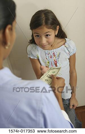 High angle view of a mother giving money to her daughter View Large Photo Image Stock Image - High angle view of a mother giving money to her daughter. Fotosearch