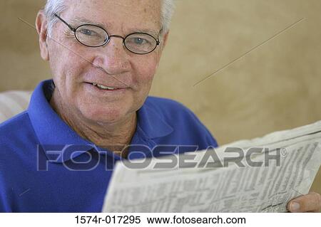 Portrait of a senior man reading a newspaper View Large Photo Image Stock Photography - Portrait of a senior man reading a newspaper. Fotosearch