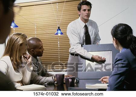Business executives at a presentation in a conference room View Large Photo Image Stock Image - Business executives at a presentation in a conference room. Fotosearch