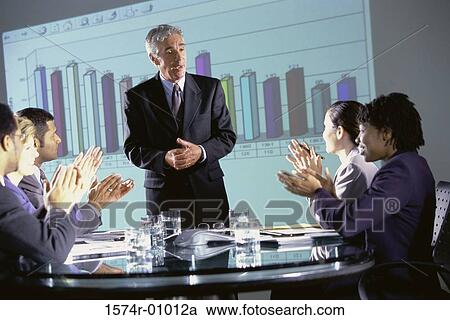 Business executives clapping at a presentation in the conference room View Large Photo Image Stock Image - Business executives clapping at a presentation in the conference room. Fotosearch