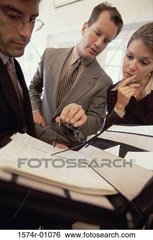 Stock Photograph - Business executives having a discussion. Fotosearch