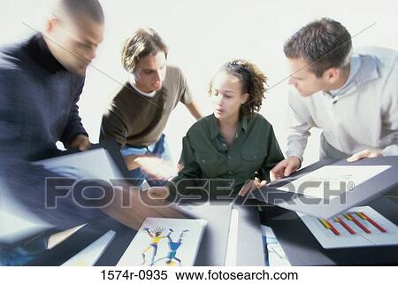 Stock Photography - Business executives having a discussion. Fotosearch