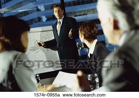 Business executives in a meeting in conference room View Large Photo Image Stock Image - Business executives in a meeting in conference room. Fotosearch