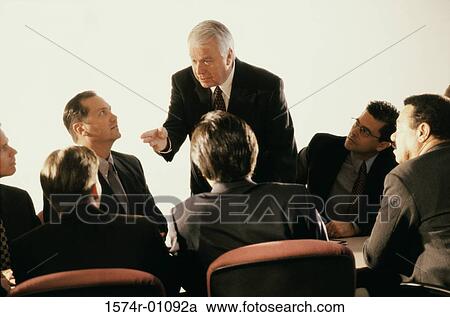 Stock Image - Business executives in a meeting. Fotosearch