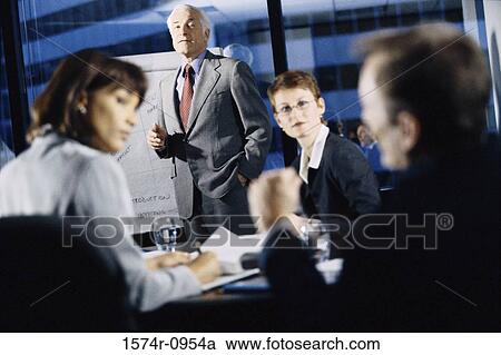 Business executives in a meeting View Large Photo Image Stock Image - Business executives in a meeting. Fotosearch