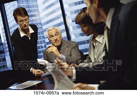 Stock Image - Business executives in a meeting. Fotosearch
