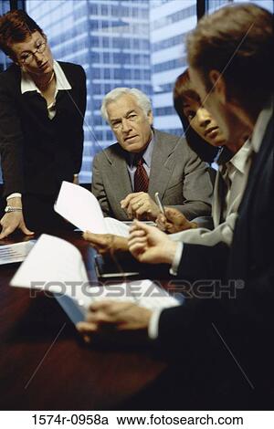 Stock Image - Business executives in a meeting. Fotosearch