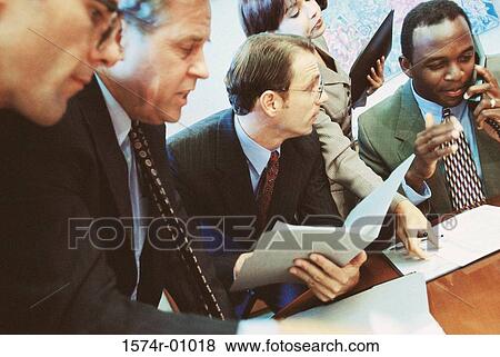 Stock Photo - Business executives in a meeting. Fotosearch