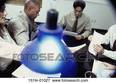 Stock Photo - Business executives in a meeting. Fotosearch