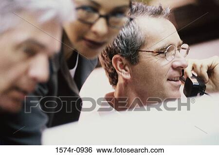Business executives in a meeting View Large Photo Image Stock Photograph - Business executives in a meeting. Fotosearch