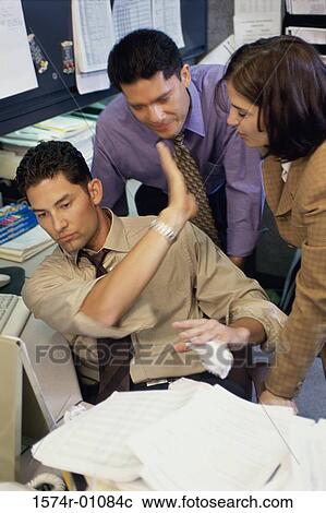 Stock Image - Business executives in an office. Fotosearch
