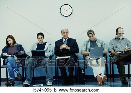 Business executives sitting in a row operating laptops View Large Photo Image Stock Image - Business executives sitting in a row operating laptops. Fotosearch