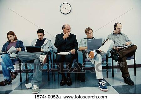 Business executives sitting in a row operating laptops View Large Photo Image Stock Image - Business executives sitting in a row operating laptops. Fotosearch