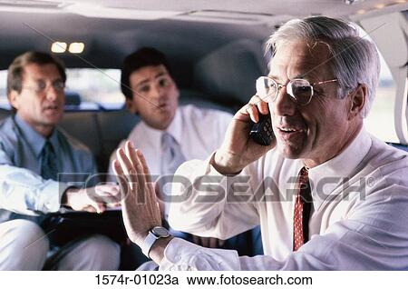 Stock Image - Businessman talking on a mobile phone. Fotosearch