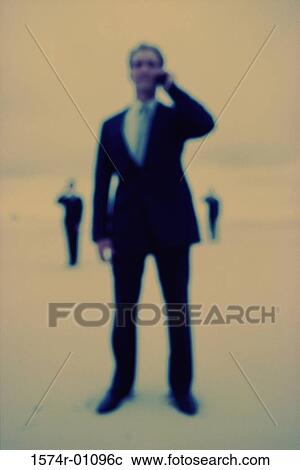 Businessman talking on a mobile phone View Large Photo Image Stock Image - Businessman talking on a mobile phone. Fotosearch