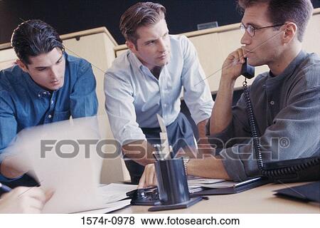 Businessmen in a meeting View Large Photo Image Stock Photo - Businessmen in a meeting. Fotosearch