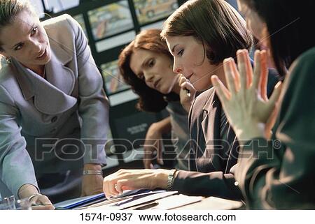 Businesswomen in a meeting View Large Photo Image Stock Photo - Businesswomen in a meeting. Fotosearch