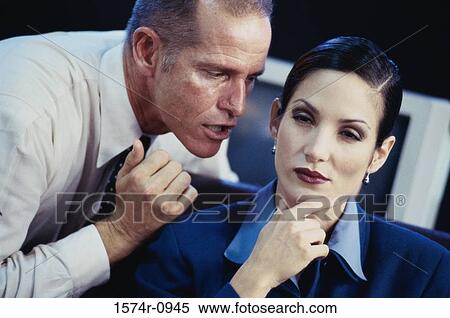 Stock Photography - Close-up of a businessman and a businesswoman. Fotosearch