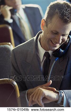 Close-up of a businessman talking on a landline telephone View Large Photo Image Stock Image - Close-up of a businessman talking on a landline telephone. Fotosearch