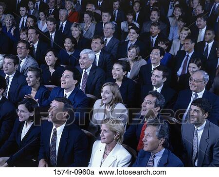 Crowd of business executives sitting together in a hall View Large Photo Image Stock Image - Crowd of business executives sitting together in a hall. Fotosearch