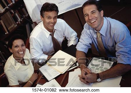 High angle view of business executives in a meeting View Large Photo Image Stock Image - High angle view of business executives in a meeting. Fotosearch