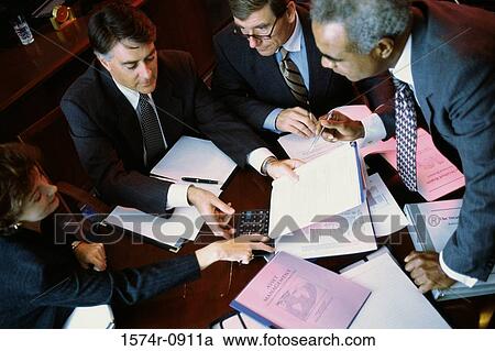 Stock Image - High angle view of business executives in a meeting. Fotosearch