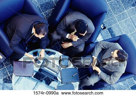 High angle view of three businessmen sitting on couches View Large Photo Image Stock Image - High angle view of three businessmen sitting on couches. Fotosearch