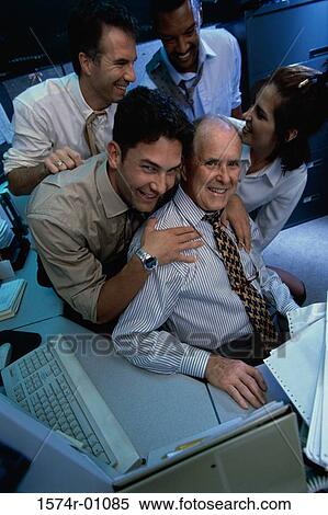 Stock Photography - Portrait of a group of business executives in an office. Fotosearch