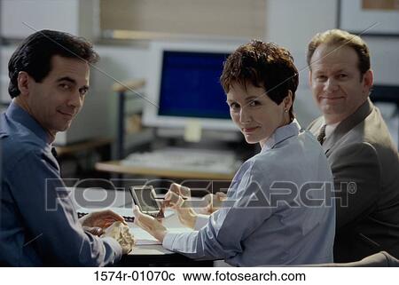 Portrait of business executives in a meeting View Large Photo Image Stock Image - Portrait of business executives in a meeting. Fotosearch