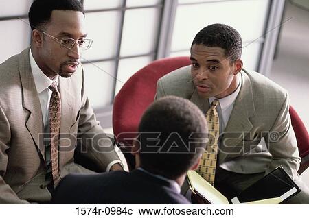 Three businessmen in a meeting View Large Photo Image Stock Image - Three businessmen in a meeting. Fotosearch