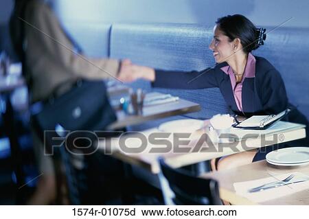 Two business executives shaking hands View Large Photo Image Stock Image - Two business executives shaking hands. Fotosearch