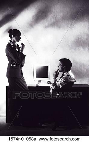 Stock Image - Two business executives talking. Fotosearch