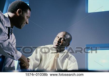 Two businessmen shaking hands View Large Photo Image Stock Image - Two businessmen shaking hands. Fotosearch