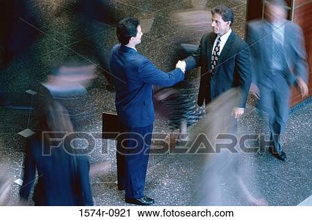 Two businessmen shaking hands View Large Photo Image Stock Image - Two businessmen shaking hands. Fotosearch