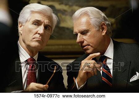 Stock Image - Two businessmen talking. Fotosearch