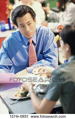 Young business executives in a meeting View Large Photo Image Stock Image - Young business executives in a meeting. Fotosearch