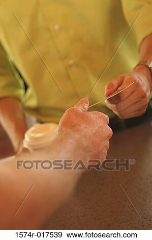 Mid section view of a man giving a credit card to another man View Large Photo Image Stock Photo - Mid section view of a man giving a credit card to another man. Fotosearch