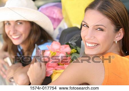 Picture - Portrait of two young women smiling. Fotosearch