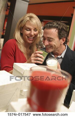 Young couple selecting candles in a store View Large Photo Image Stock Photo - Young couple selecting candles in a store. Fotosearch