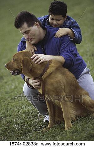 Father and his son with their dog View Large Photo Image Stock Image - Father and his son with their dog. Fotosearch