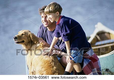 Father with his son and their dog View Large Photo Image Stock Image - Father with his son and their dog. Fotosearch