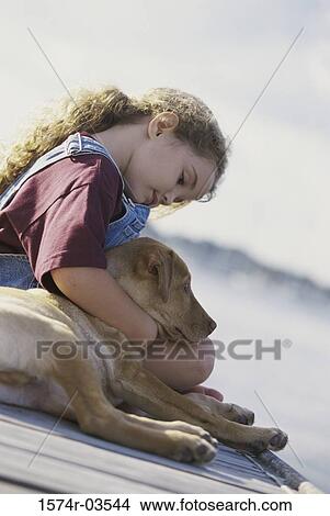 Girl sitting with her dog View Large Photo Image Picture - Girl sitting with her dog. Fotosearch
