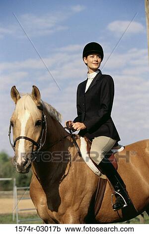 Jockey sitting on a horse View Large Photo Image Stock Image - Jockey sitting on a horse. Fotosearch
