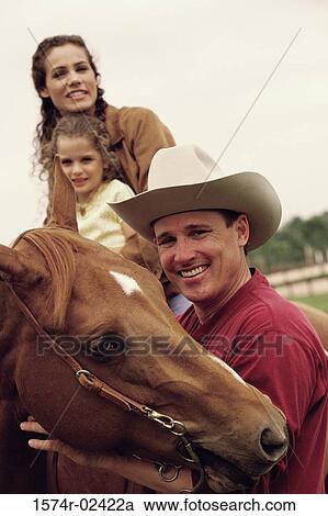 Mother and her daughter sitting on a horse View Large Photo Image Stock Image - Mother and her daughter sitting on a horse. Fotosearch