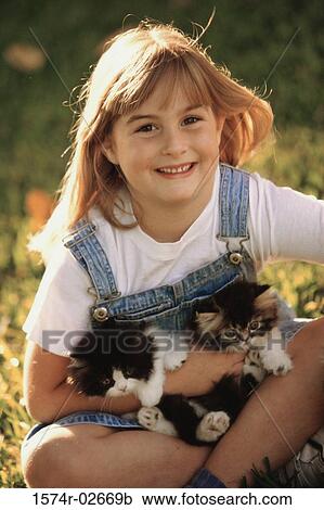 Portrait of a girl holding cats View Large Photo Image Stock Image - Portrait of a girl holding cats. Fotosearch